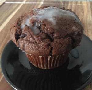 Cum food: A muffin freshly inseminated with sperm on a black sperm plate.