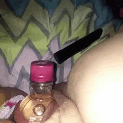 Squirting while squeezing a big bottle out of your pussy.